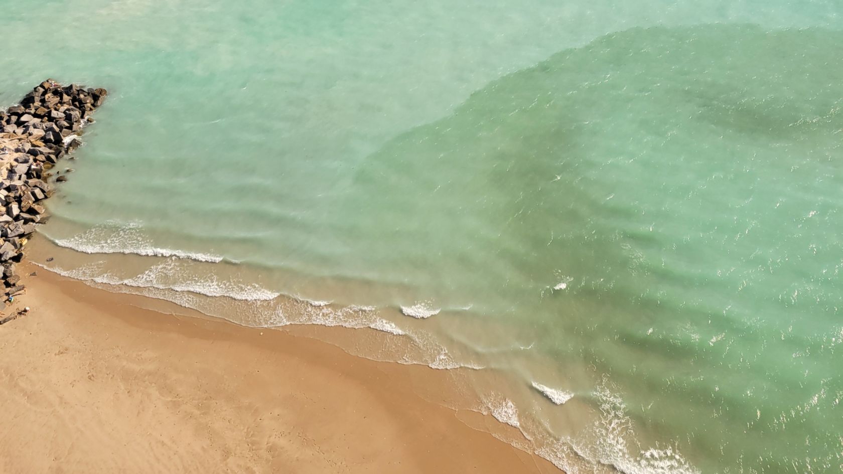 sand bypass turbidity plume shoreline aerial