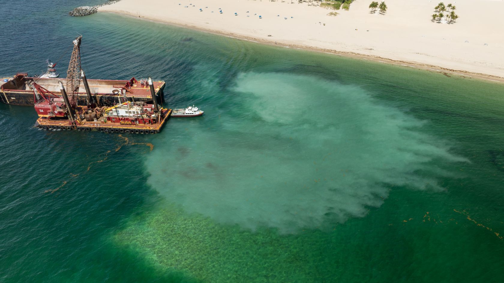 sand bypass turbidity plume swimming beach aerial